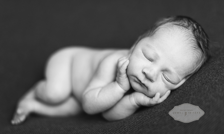 Black and white, side lying, chin in hands newborn photograph | Jewel Images Bend, Oregon Newborn Photographer www.jewel-images.com #newborn #photography #newbornphotographer #jewelimages